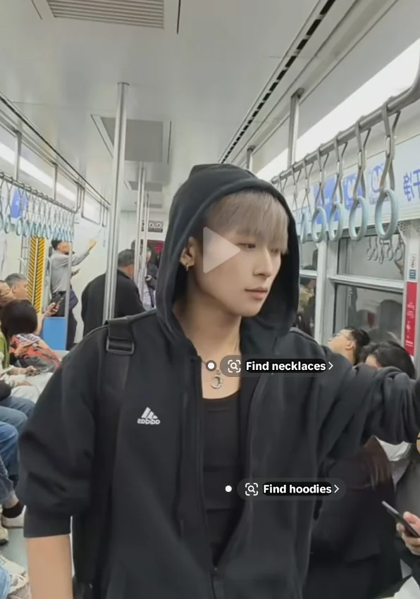 Lee in a black hoodie